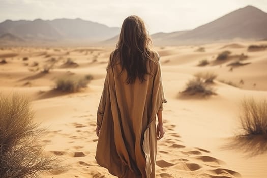 Rear view of a young woman in the desert.