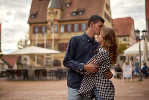 Young Cute Female Hugs Boyfriend. In Autumn Outdoor. Lovers Walking in Park. Attractive Funny Couple. Lovestory in Forest. Man and Woman. Cute Lovers in the Park. Family Concept. Happy Couple.