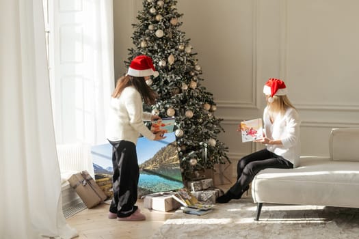 photo canvas near the christmas tree as a gift. High quality photo