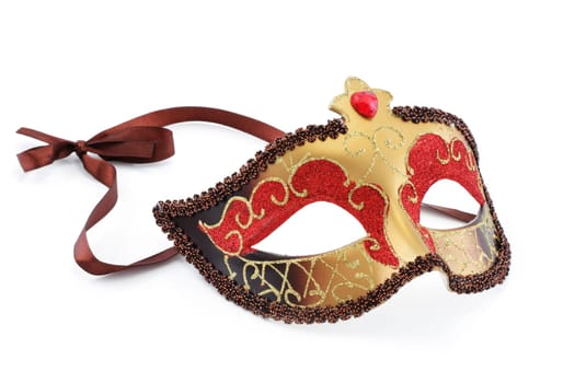 A gold red and brown carnival mask