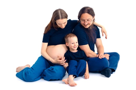 beautiful european happy family with a pregnant mother, the father and a son together. High quality photo