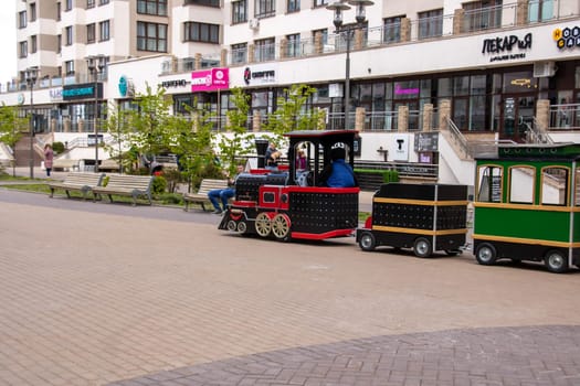 Belarus, Minsk - 7 june, 2023: Children's train rides down the street close up