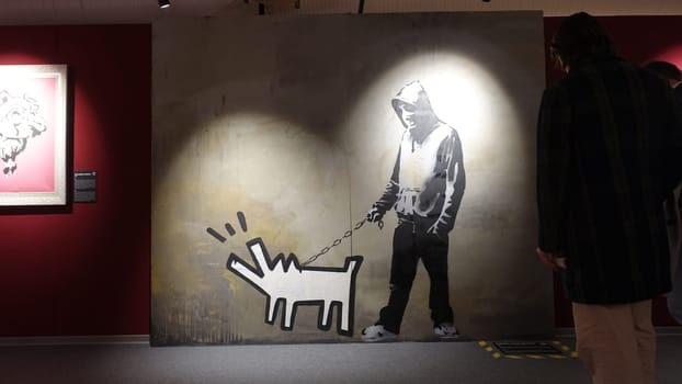 Stockholm, Sweden, December 29 2023. Art exhibition. The mystery of Banksy A genius mind. Dog.