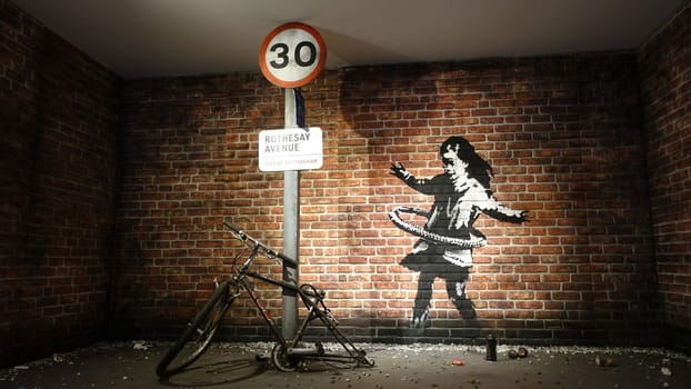 Stockholm, Sweden, December 29 2023. Art exhibition. The mystery of Banksy A genius mind. Little girl.