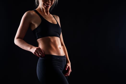 Young strong sporty athletic fitness trainer instructor woman. Workout sport conception