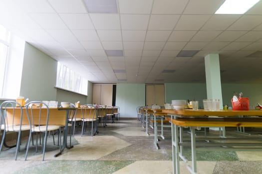 Cafeteria, dining room in a university, cafe with tables and chairs, counter bar hotel.