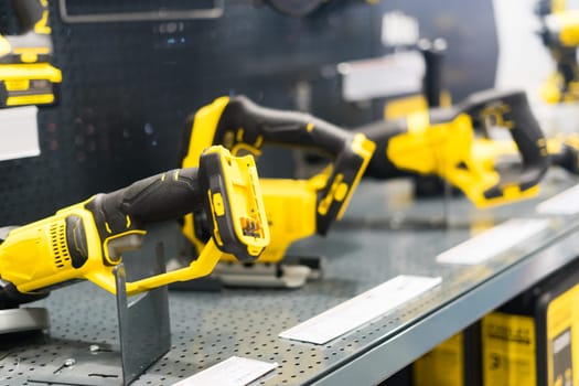 Power tools, drills and hammers of various manufacturers are sold in hardware store.