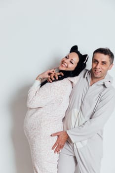 Husband and wife Man and woman in pajamas in the morning in a bright room