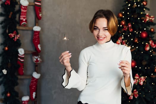 Woman with sparkler celebrates New Year's Eve