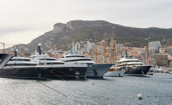 Monaco, Monte Carlo, 29 September 2022 - a lot of luxury yachts at the famous motorboat exhibition, the most expensive boats for the richest people, yacht brokers, boat traffic. High quality photo