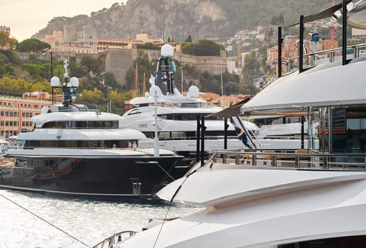 Monaco, Monte Carlo, 29 September 2022 - a lot of luxury yachts at the famous motorboat exhibition, the most expensive boats for the richest people, yacht brokers, boat traffic. High quality photo