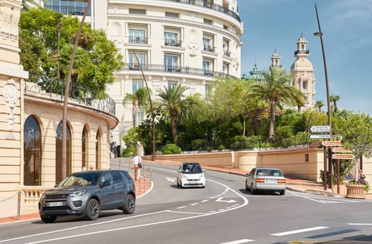 Monaco, Monte-Carlo, 29 September 2022 - Famous landmark Casino Monte-Carlo and hotel de Paris at sunny day, lifestyle of principality, wealth life, expensive luxury cars, sightseeing. High quality photo