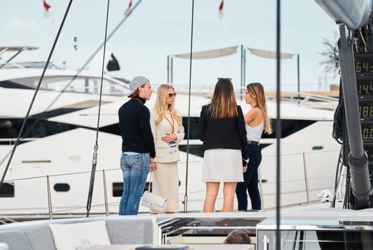 Monaco, Monte Carlo, 29 September 2022 - Invited wealthy clients inspect mega yachts at the largest fair exhibition in the world yacht show MYS, port Hercules, yacht brokers, sunny weather. High quality photo