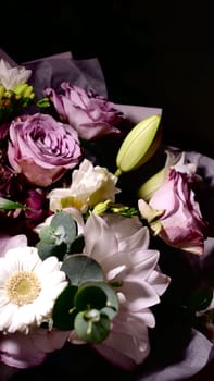 Rotating spring summer floral pastel arrangement in the background close up. Celebrating Mother's Day, International Women's Day March 8. Flowers gardenia, rose, Lilia, eucalyptus