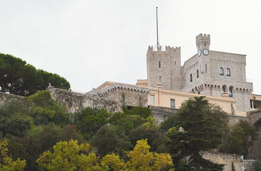 Monaco, Monte Ville, 29 September 2022 - Palace of Prince of Monaco, mountain of royalty, walls of old town, flag of principality . High quality photo