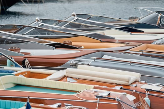 Monaco, Monte Carlo, 29 September 2022 - Few luxury retro motorboats Riva in a row at the famous motorboat exhibition in the principality, elegance boats for rich clients. High quality photo