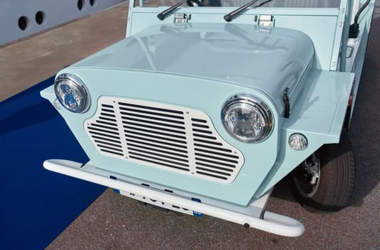 famous blue vintage open-top car at the yacht show in Monaco on a sunny day, close-up. High quality photo