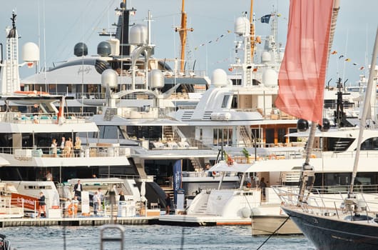 Monaco, Monte Carlo, 29 September 2022 - The famous motorboat exhibition, mega yacht show, clients and yacht brokers discuss the novelties of the boating industry, look at the mega yachts presented. High quality photo