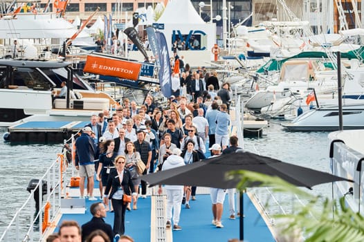 Monaco, Monte Carlo, 29 September 2022 - The famous motorboat exhibition, mega yacht show, clients and yacht brokers discuss the novelties of the boating industry, look at the mega yachts presented. High quality photo