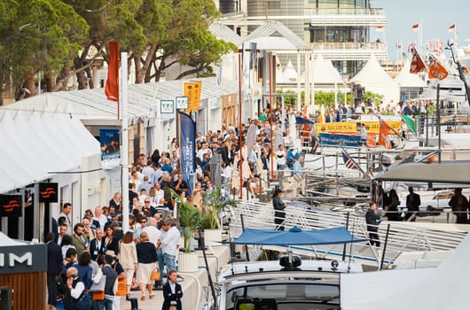 Monaco, Monte Carlo, 29 September 2022 - The famous motorboat exhibition, mega yacht show, clients and yacht brokers discuss the novelties of the boating industry, look at the mega yachts presented. High quality photo