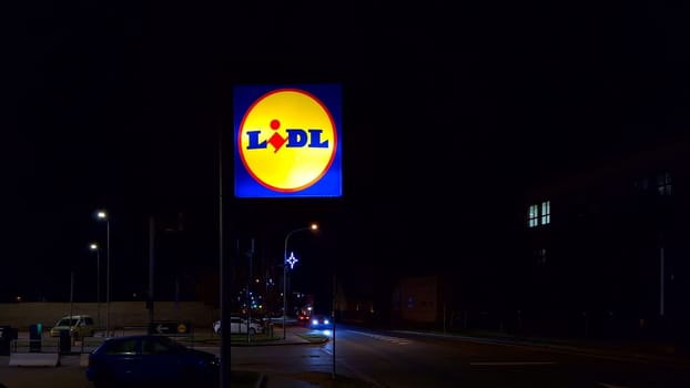 HUSTOPECE, CZECH REPUBLIC - DECEMBER 17, 2023: LIDL logo on hypermarket from German chain, part of Schwartz Gruppe which also owns Kaufland. Lidl is a German international discount retailer chain that operates over 12,000 stores, present in every member state of the European Union, Serbia, Switzerland, the United Kingdom and the United States.