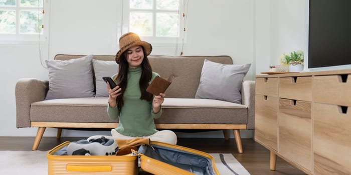 Woman packing a suitcase for a new travel trip. bag and luggage for journey.