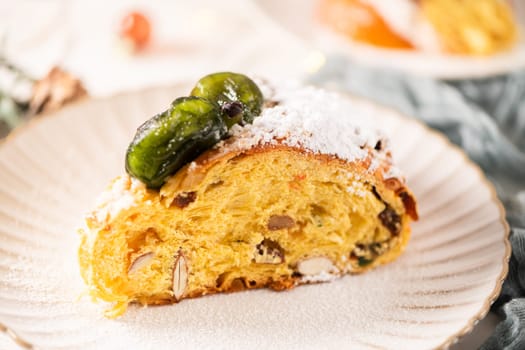 Bolo do Rei or King's Cake, Made for Christmas, Carnavale or Mardi Gras with Christmas season elements in Background.