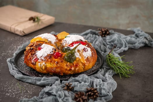 Bolo Rei or Kings Cake is a traditional Xmas cake with fruits raisins nut and icing on kitcthen countertop. Is made for Christmas, Carnavale or Mardi Gras