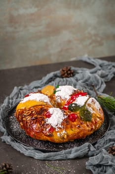 Bolo Rei or Kings Cake is a traditional Xmas cake with fruits raisins nut and icing on kitcthen countertop. Is made for Christmas, Carnavale or Mardi Gras