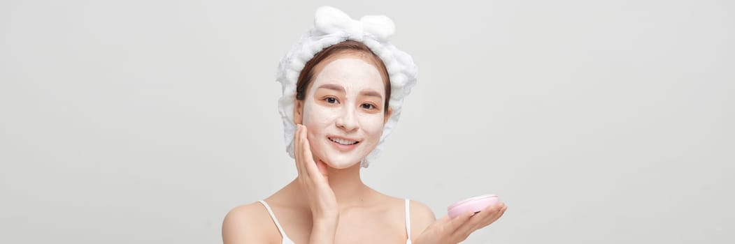 Beautiful woman with cosmetic mud facial procedure, spa health concept, banner