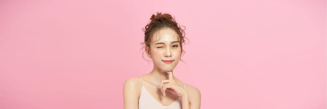 Casual beauty concept of pretty Asian girl on pink background