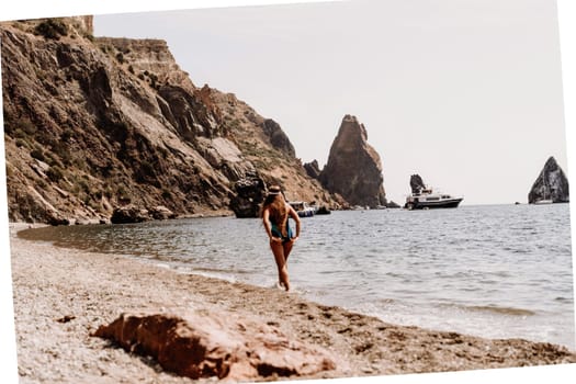 Woman beach vacation photo. A happy tourist in a blue bikini enjoying the scenic view of the sea and volcanic mountains while taking pictures to capture the memories of her travel adventure