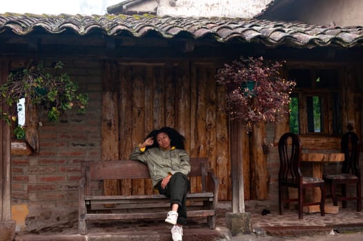 a young afro latin american girl on a relaxing rural tourism vacation . tourism day. High quality photo