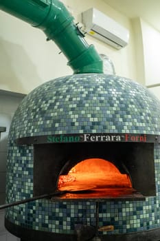 Napoli, Italy: 2023 November 18: Typical Neapolitan oven in La Antica Pizzeria Da Michele from 1870 where the authentic Margherita pizza is made,