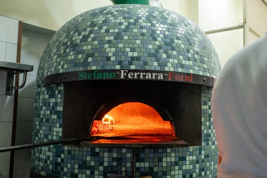 Napoli, Italy: 2023 November 18: Typical Neapolitan oven in La Antica Pizzeria Da Michele from 1870 where the authentic Margherita pizza is made,