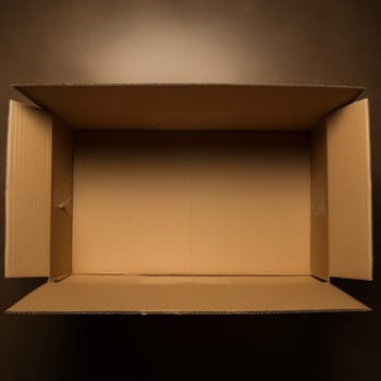 Paper cardboard box with open top on dark background isolated AI