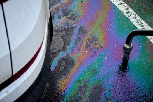 Engine oil stains of car. Leak under the car when the car is park.