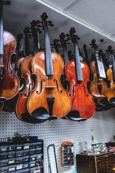 violins are handing in a shop ready