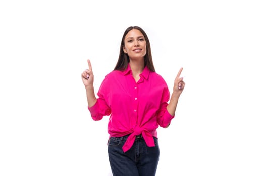 young brunette secretary woman dressed in a pink shirt rejoices at the promotion on a white background.