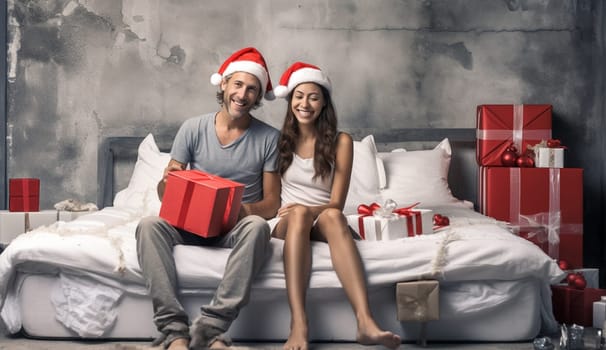 young adult couple celebrate christmas at home hading over gifts wearing jelly bag caps. High quality photo