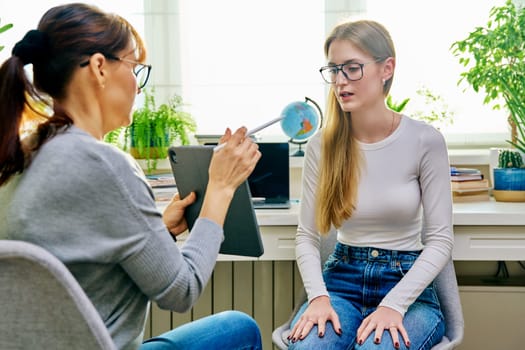 Psychologist, social worker, behavior, counselor talking with teenage girl student, using digital tablet for work. Psychology psychotherapy therapy, adolescence youth, social life, mental health