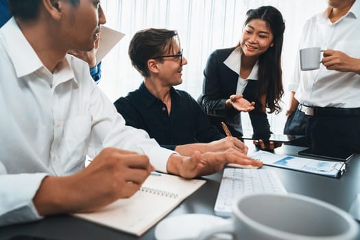 Group of diverse office worker employee working together on strategic business marketing planning in corporate office room. Positive teamwork in business workplace concept. Prudent