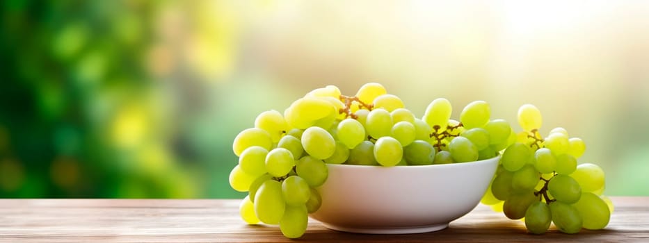 Grapes in a bowl against the backdrop of the garden. Selective focus. Food.