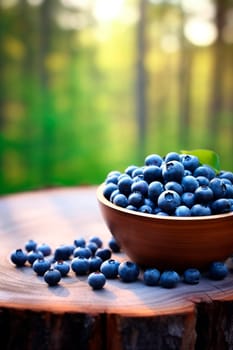 Blueberries in a bowl in the garden. Selective focus. Food.