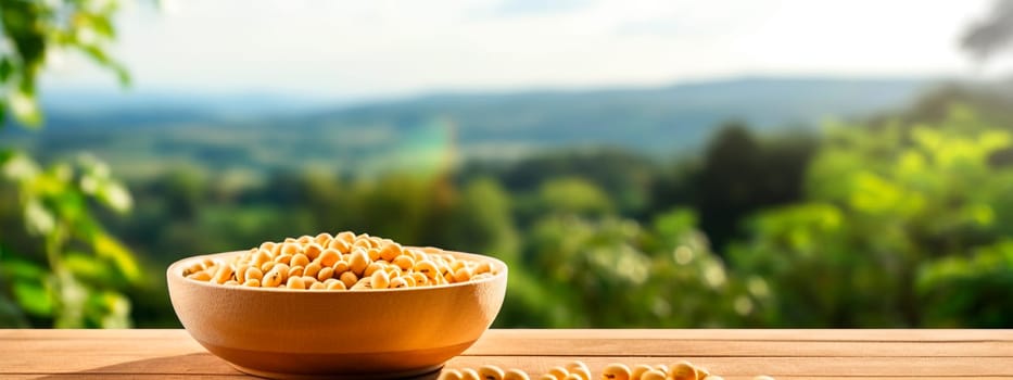 Soybeans in a bowl in the garden. Selective focus. Food.