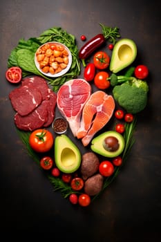 Heart made of keto food on a dark background. Selective focus. Food.