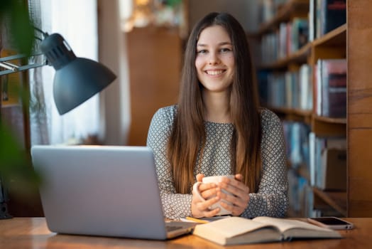 Student taking a break from long and hard studying for a cup of hot tea or coffee