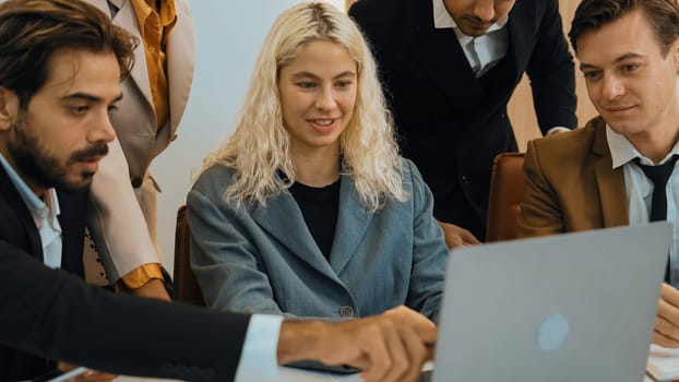 Diverse office worker employee working and brainstorm on strategic business marketing planning. Teamwork and positive attitude create productive and supportive in ornamented business office workplace.