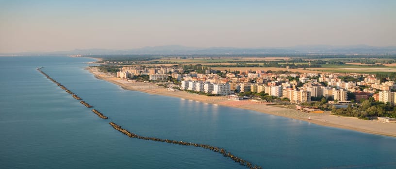Drone shot of Adriatic shoreline.Summer vacation concept.Lido Adriano town,Adriatic coast, Emilia Romagna,Italy.