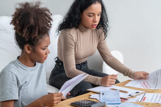 Stressed African American women has financial problems with credit card debt to pay crucial show concept of bad personal money and mortgage pay management crisis.